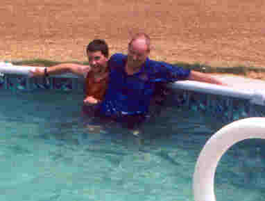 My Grandpa and I playing in the pool.